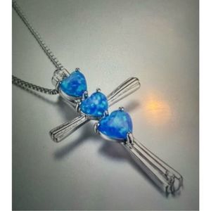 BLUE OPAL HEARTS ON STERLING SILVER CROSS NECKLACE